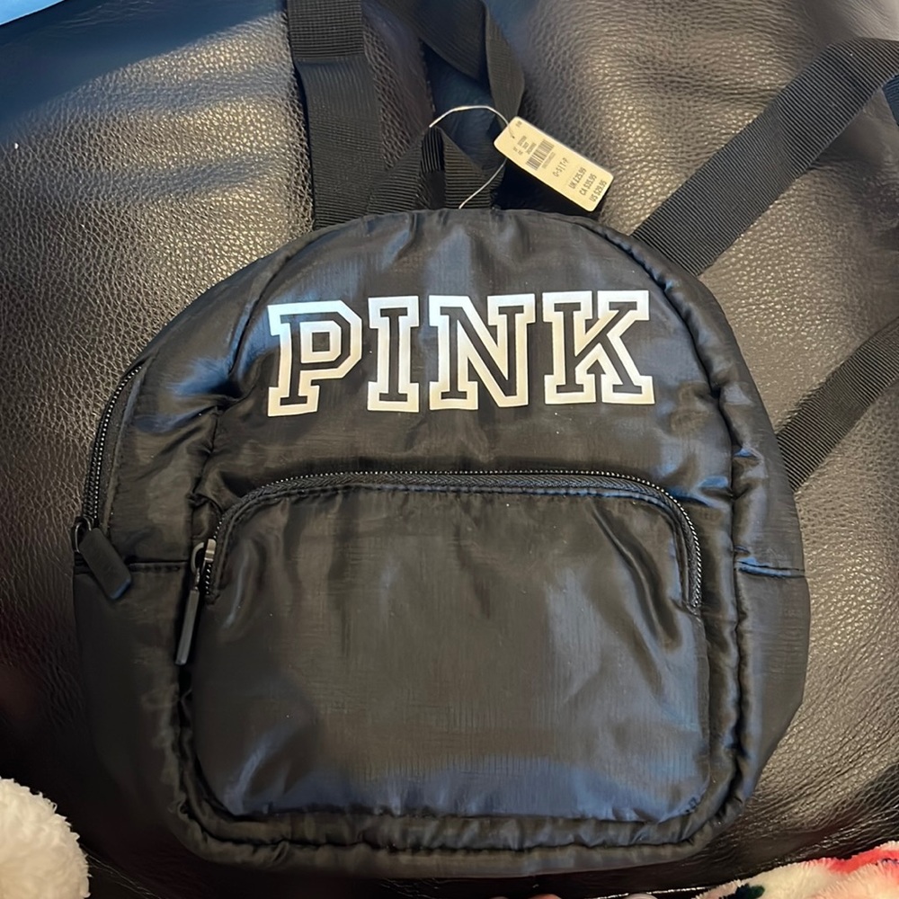 Pink small backpack. New never used!